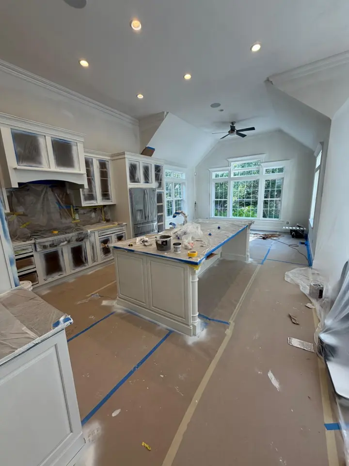 Kitchen cabinets masked and protected during prep