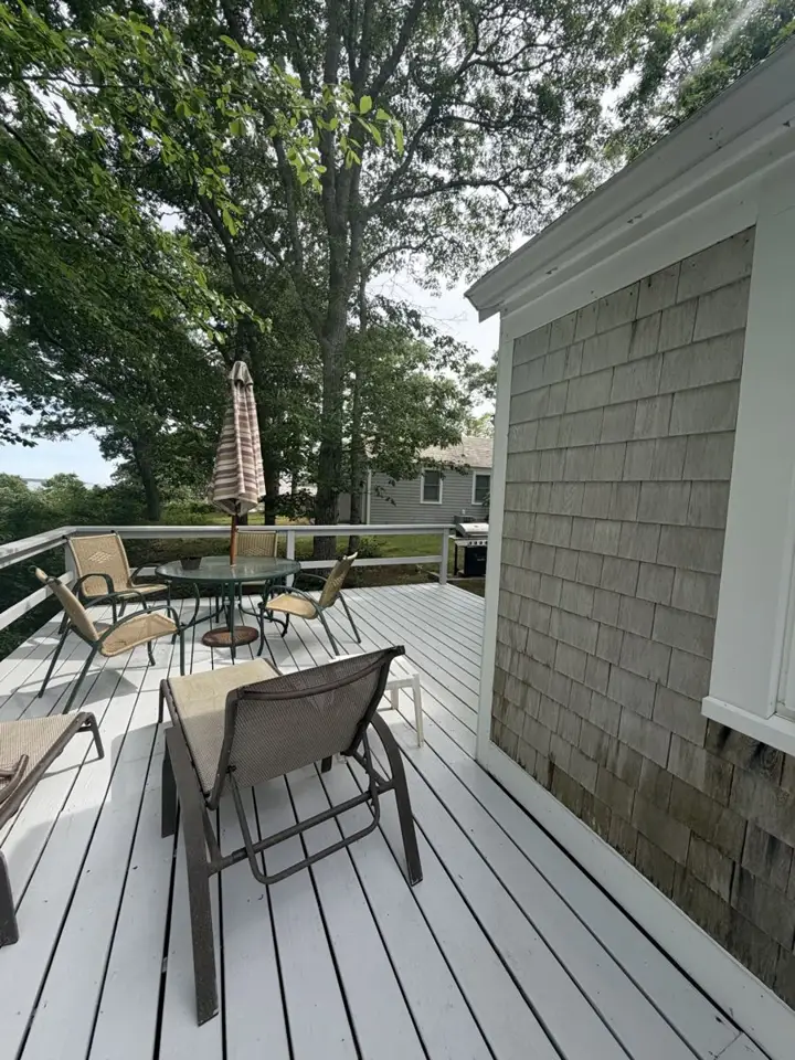 Gray painted deck with patio furniture