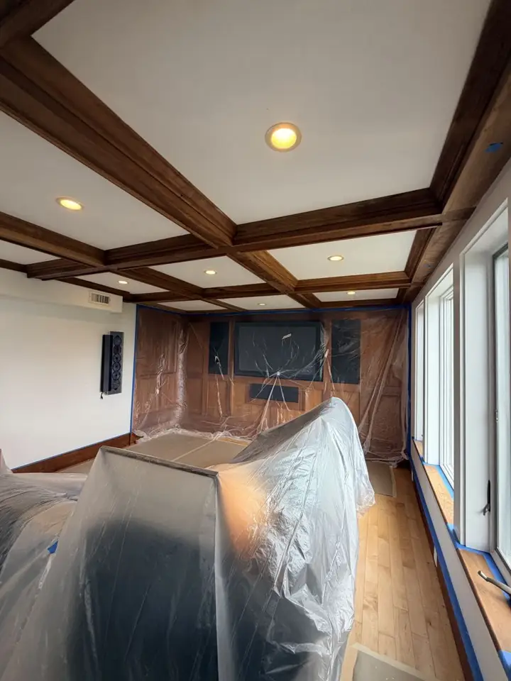 Floors and furniture covered with plastic and paper before work