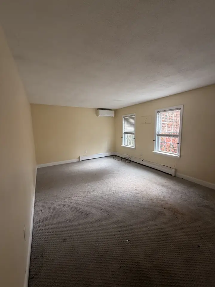 Empty room with a popcorn ceiling ready for a fresh repaint