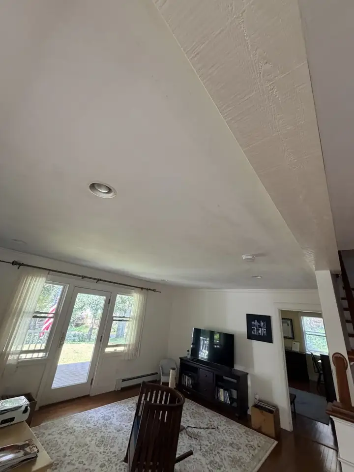 Textured ceiling in a Cape Cod living room before painting