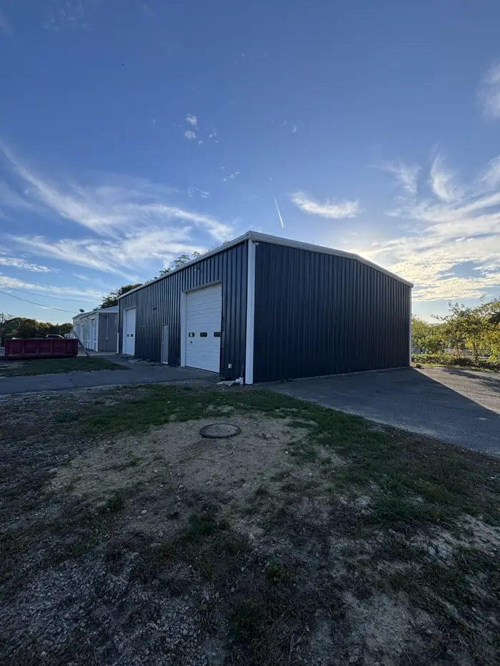 Metal commercial building under a blue sky on Cape Cod