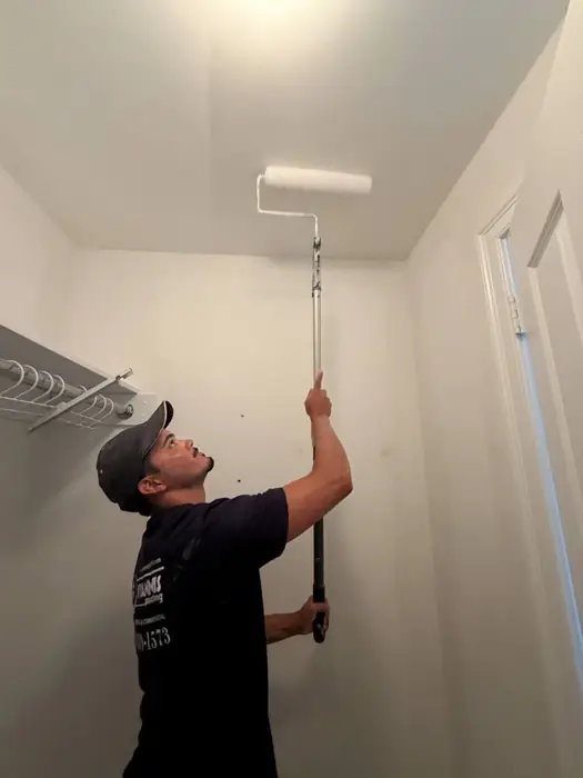 Hyannis Painting crew member rolling a ceiling
